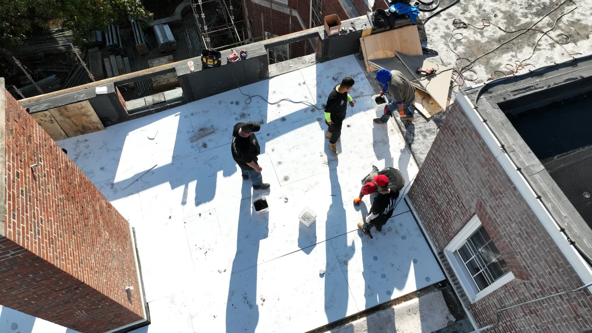 Crown Contracting crew on a flat commercial roof.