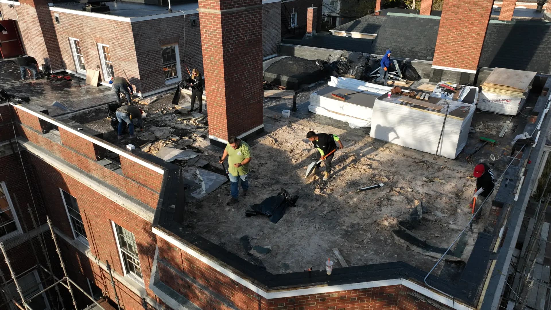 Crown Contracting crew working on a commercial roof in progress.
